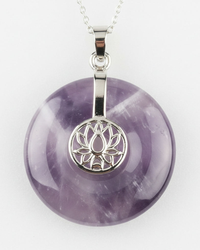 Amethyst lotus pendant necklace on silver chain – healing crystal jewelry for meditation and spiritual alignment.