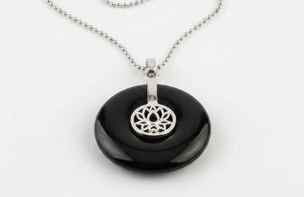 Black Agate lotus pendant necklace on silver chain – healing crystal jewelry for meditation and spiritual alignment.