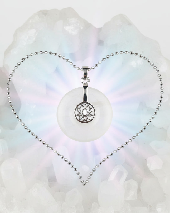 Clear Quartz lotus pendant necklace on silver chain – healing crystal jewelry for meditation and spiritual alignment.
