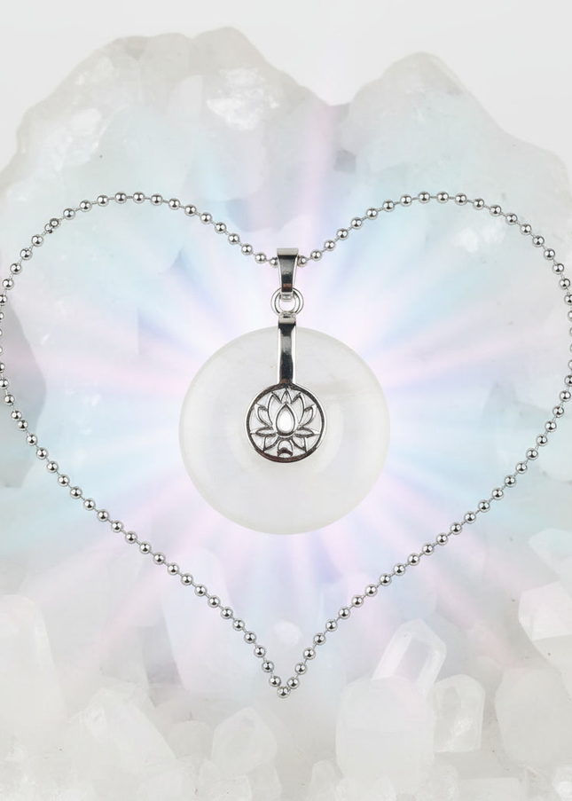 Clear Quartz lotus pendant necklace on silver chain – healing crystal jewelry for meditation and spiritual alignment.
