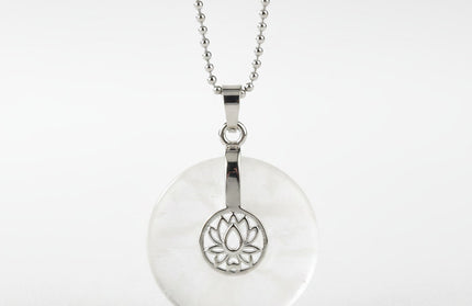 Clear Quartz lotus pendant necklace on silver chain – healing crystal jewelry for meditation and spiritual alignment.