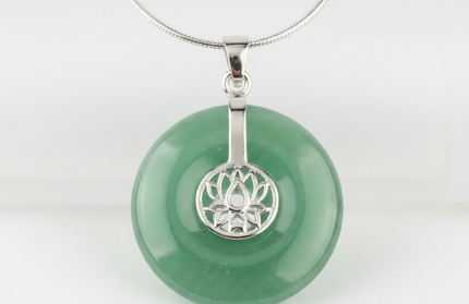 Green Aventurine lotus pendant necklace on silver chain – healing crystal jewelry for meditation and spiritual alignment.
