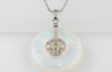 Opal lotus pendant necklace on silver chain – healing crystal jewelry for meditation and spiritual alignment.