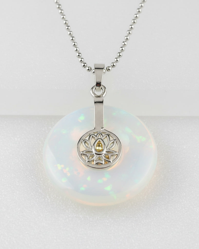 Opal lotus pendant necklace on silver chain – healing crystal jewelry for meditation and spiritual alignment.