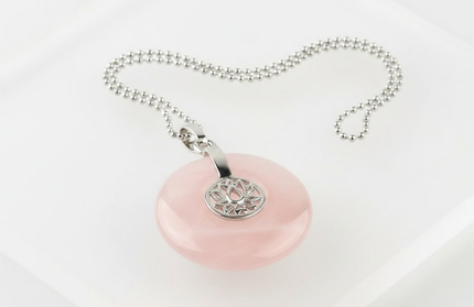 Rose Quartz lotus pendant necklace on silver chain – healing crystal jewelry for meditation and spiritual alignment.