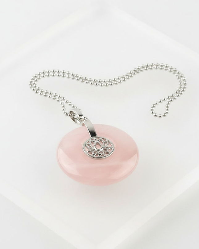 Rose Quartz lotus pendant necklace on silver chain – healing crystal jewelry for meditation and spiritual alignment.